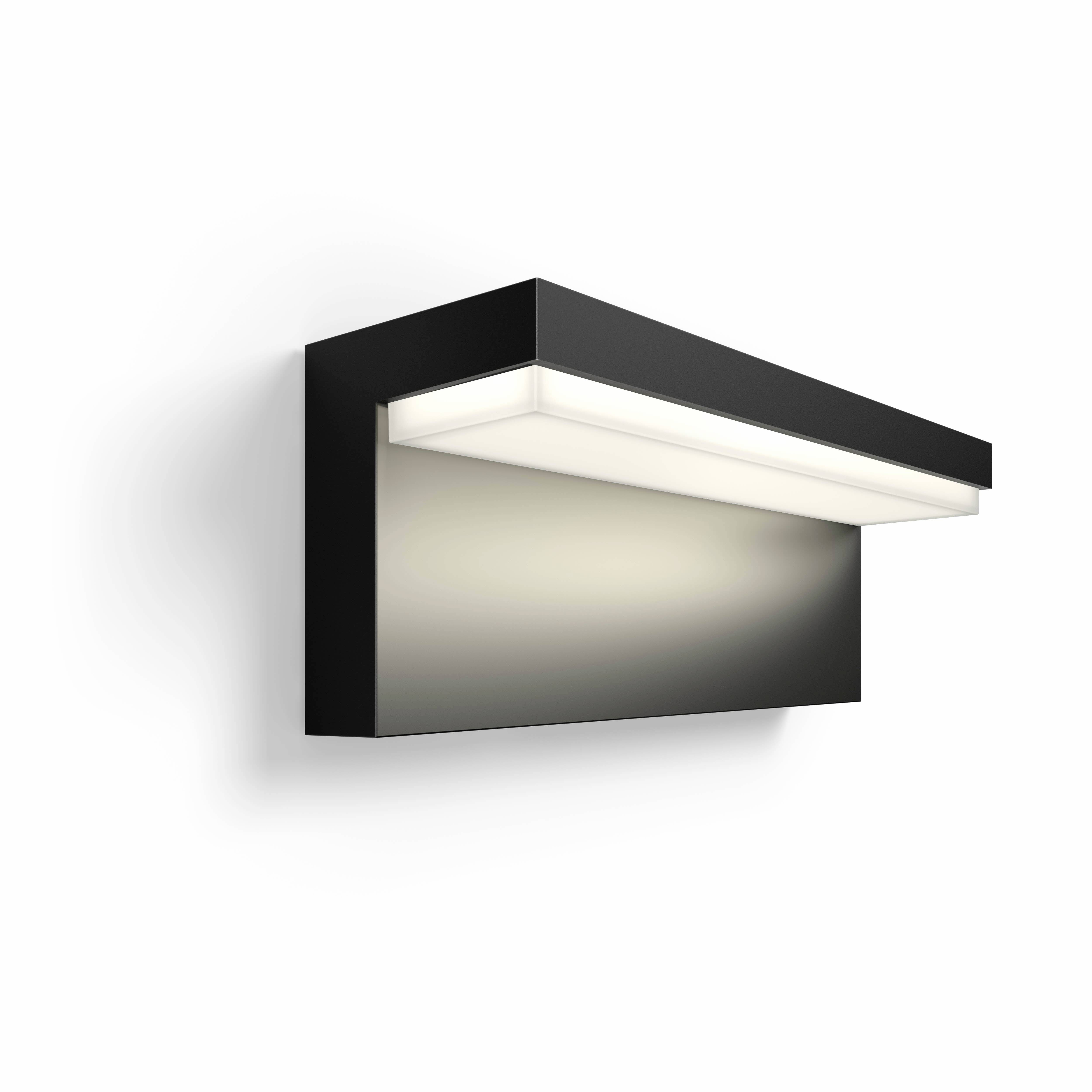 Schwarze rechteckige Wandlampe mit oben leuchtendem LED-Streifen, an einer hellen Wand montiert. Minimalistisches Design.