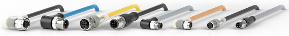 Verschiedene industrielle Steckverbinder mit farbigen Griffen liegen in einer Reihe vor.