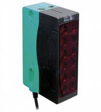 Ein rechteckiger optoelektronischer Sensor mit grünem und schwarzem Gehäuse, verwendet für industrielle Anwendungen.