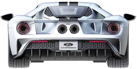 Ein silberner Sportwagen von hinten, mit zwei großen Auspuffrohren, markanten Heckleuchten und einem Ford-Logo.