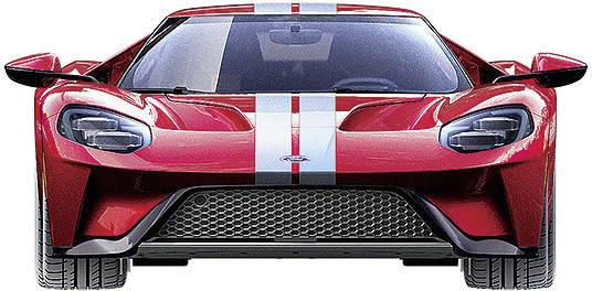 Ein roter Sportwagen mit weißen Streifen von vorne gesehen. Der Wagen hat aerodynamische Formen und große Scheinwerfer.