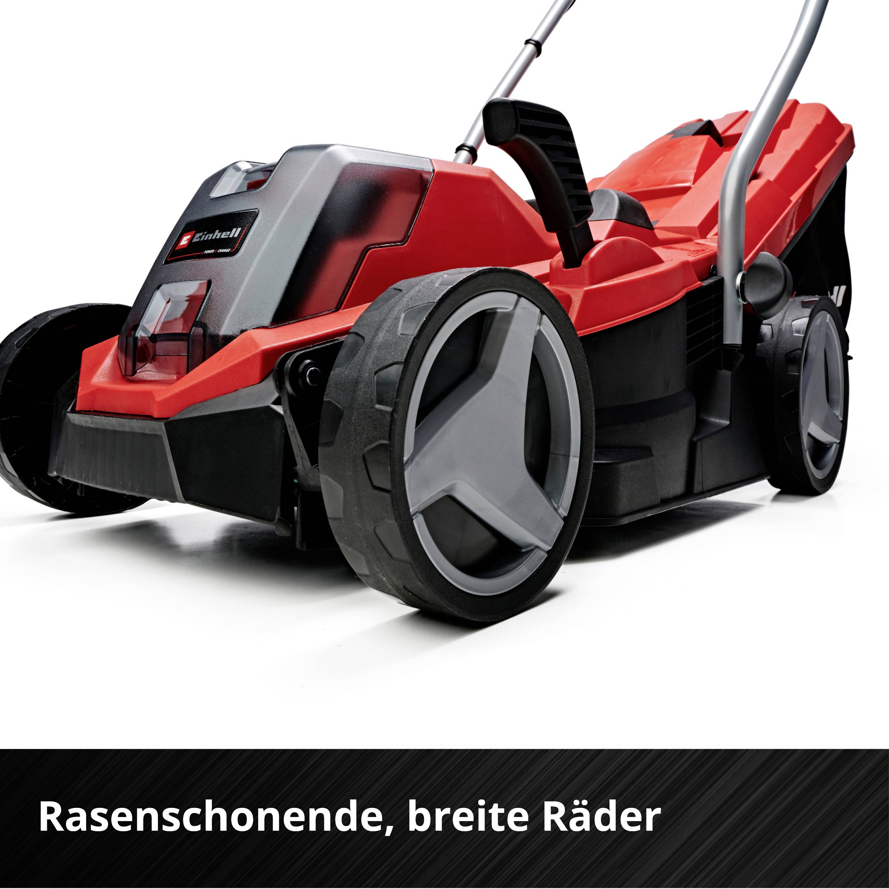Ein roter Rasenmäher mit breiten Rädern steht ausgestellt. Text am Bildrand beschreibt die Räder als 'rasenschonend, breite Räder'.