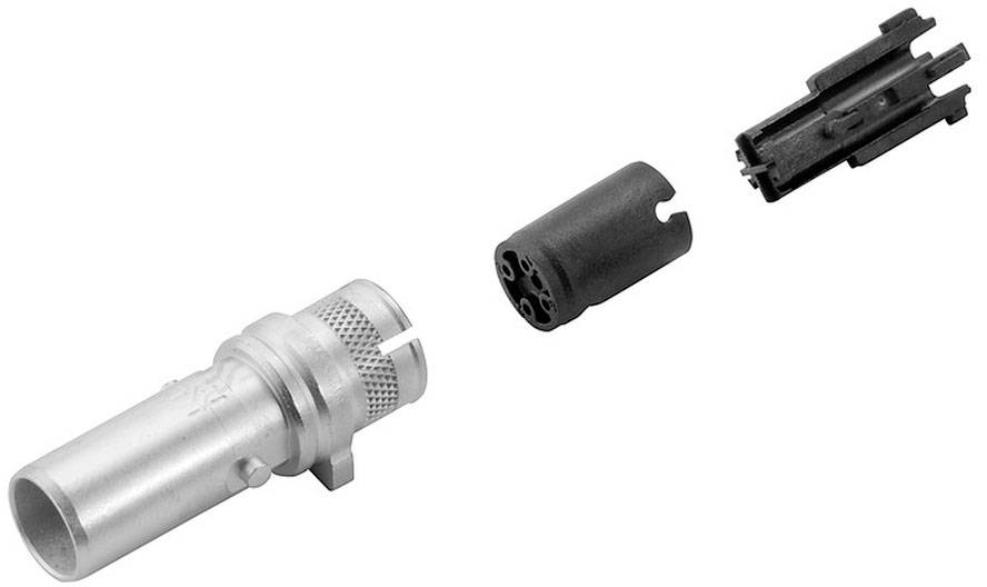 Ein Steckverbinder mit abgezogenem Innenkontakt und einem Gehäuseteil. Der Steckverbinder ist aus Metall, die anderen Teile aus Kunststoff.