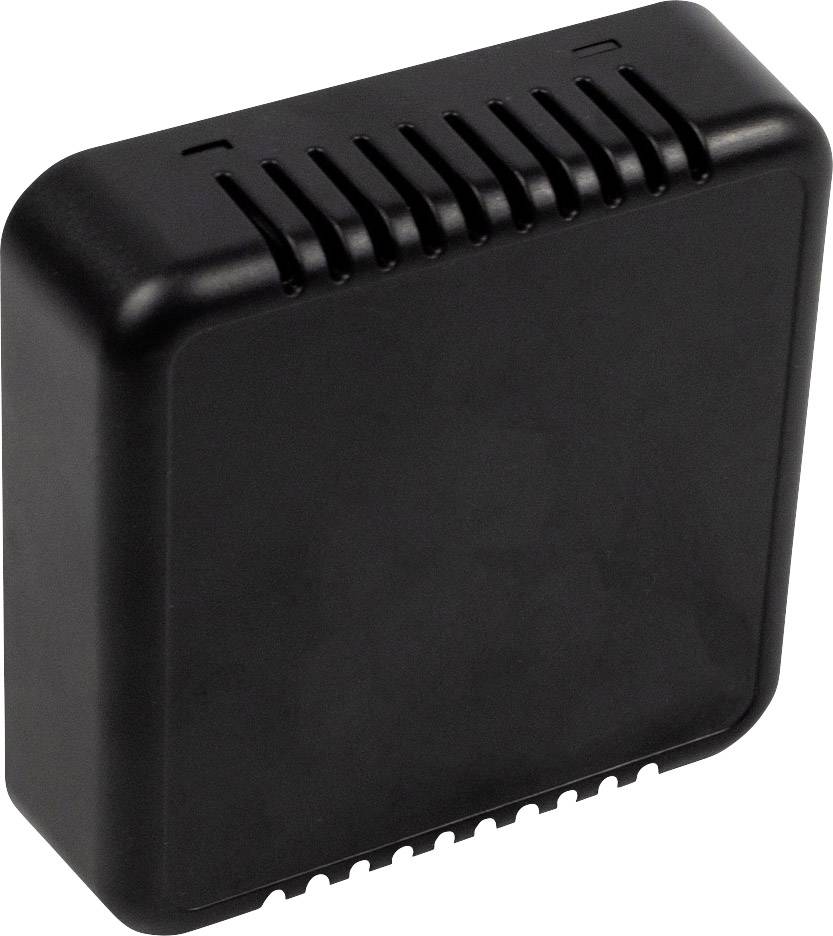 Ein kleines, rechteckiges, schwarzes Kunststoffgerät mit Belüftungsschlitzen oben und unten, möglicherweise ein Sensor oder Modem.