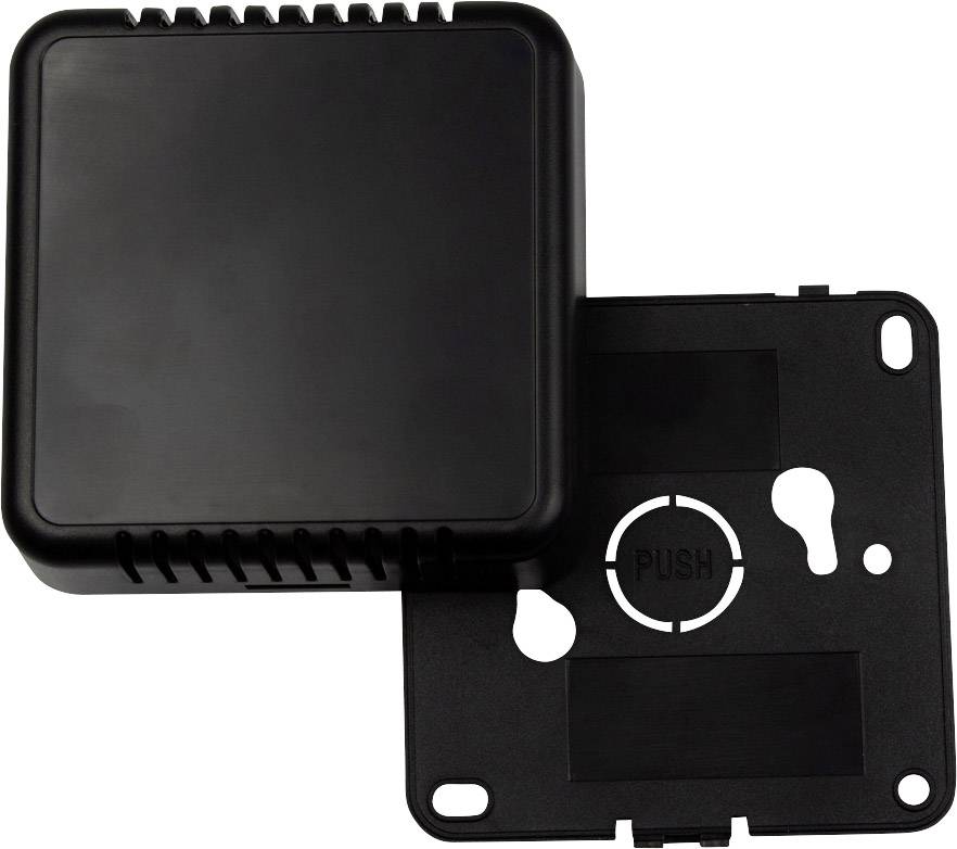 Schwarzes quadratisches Gehäuse aus Kunststoff, teilweise geöffnet, zeigt Innenansicht. Text 'PUSH' sichtbar auf der Innenseite.