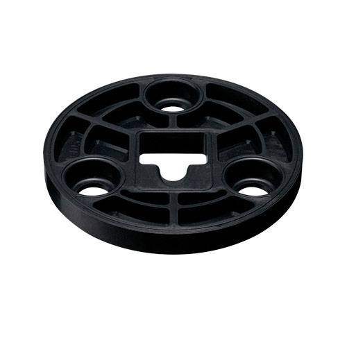 Ein rundes schwarzes Kunststoffteil mit mehreren Löchern und Aussparungen, möglicherweise Teil eines mechanischen oder technischen Systems.