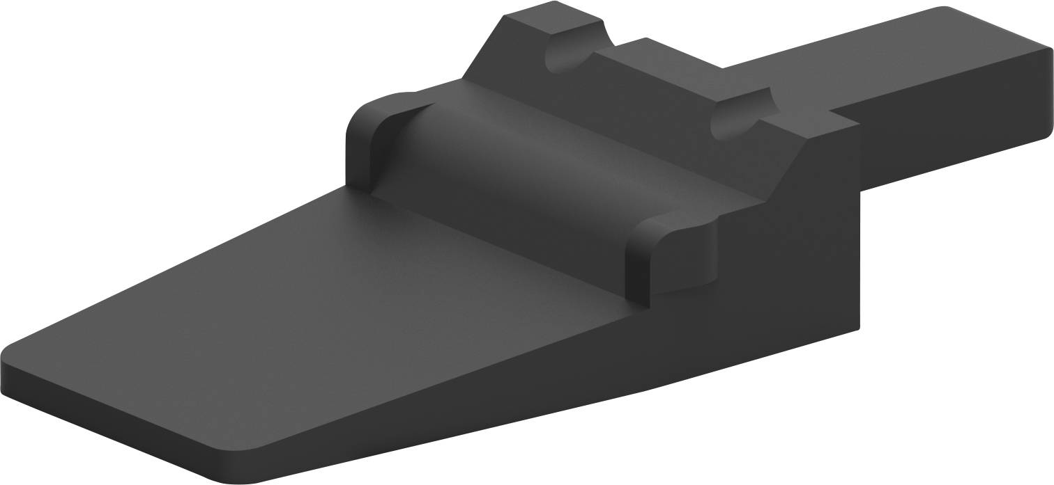 Ein schwarzes Bauteil mit einer flachen, abgeschrägten Vorderseite und erhöhter Rückseite; könnte ein Maschinenteil sein.