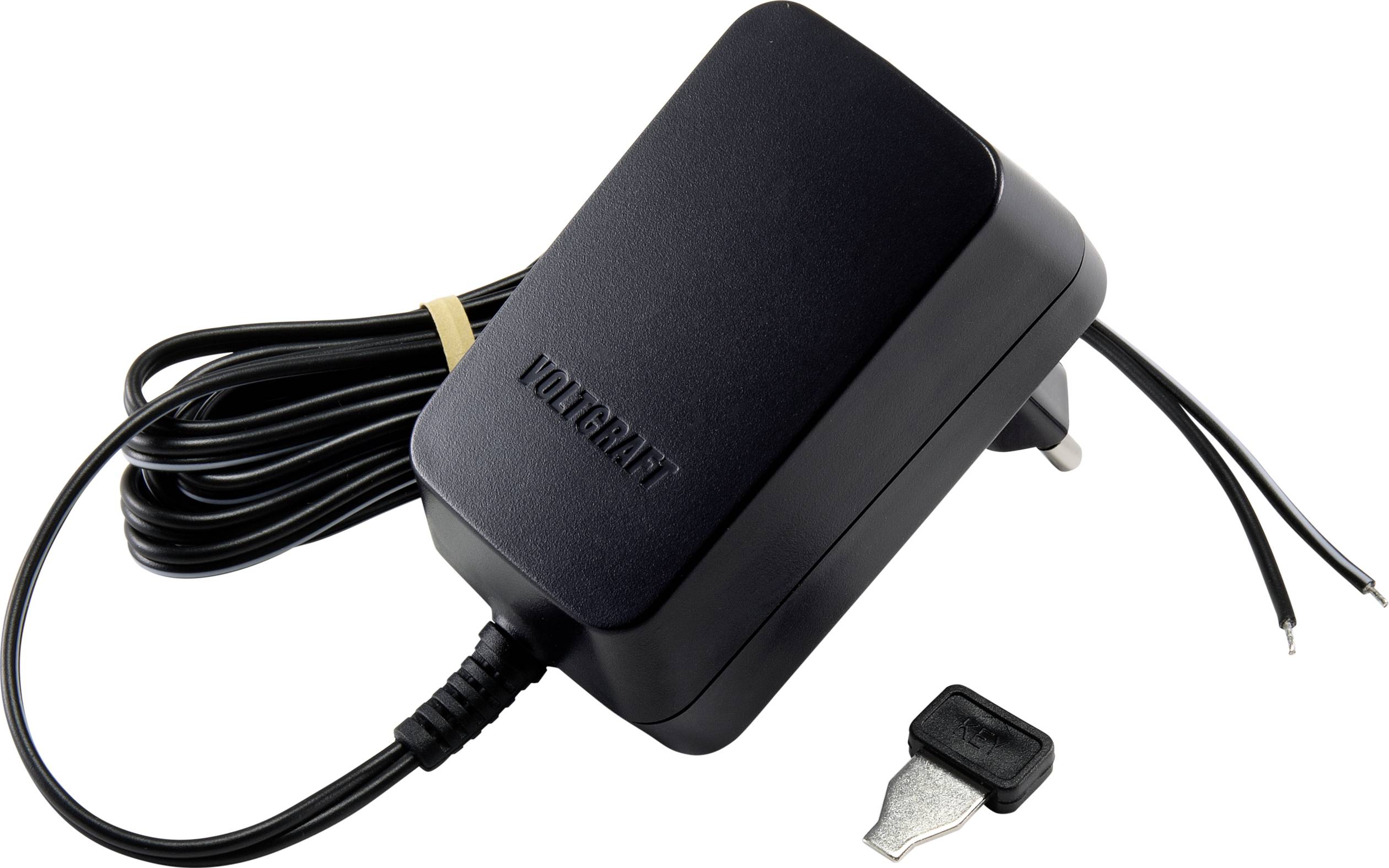Schwarzes Netzteil mit Kabel und zwei offenen Drahtenden. Daneben liegt ein kleiner Metalladapter.