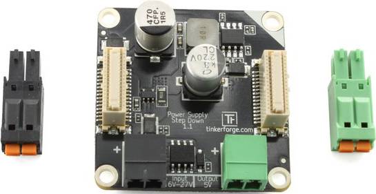 Eine elektronische Komponente mit verschiedenen Steckverbindern und Beschriftungen 'Power Supply Step Down 11', 'tinkerforge.com'.