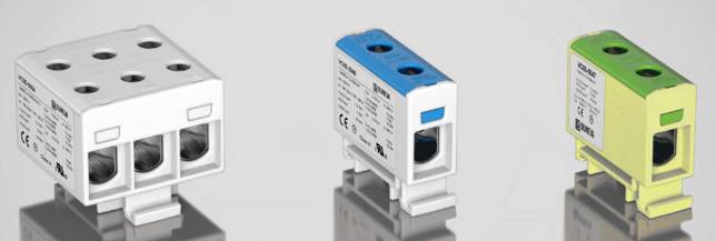 Drei elektrische Anschlussklemmen in Weiß, Blau und Gelb. Jede Klemme hat verschiedene Einsteckmöglichkeiten und Beschriftungen.