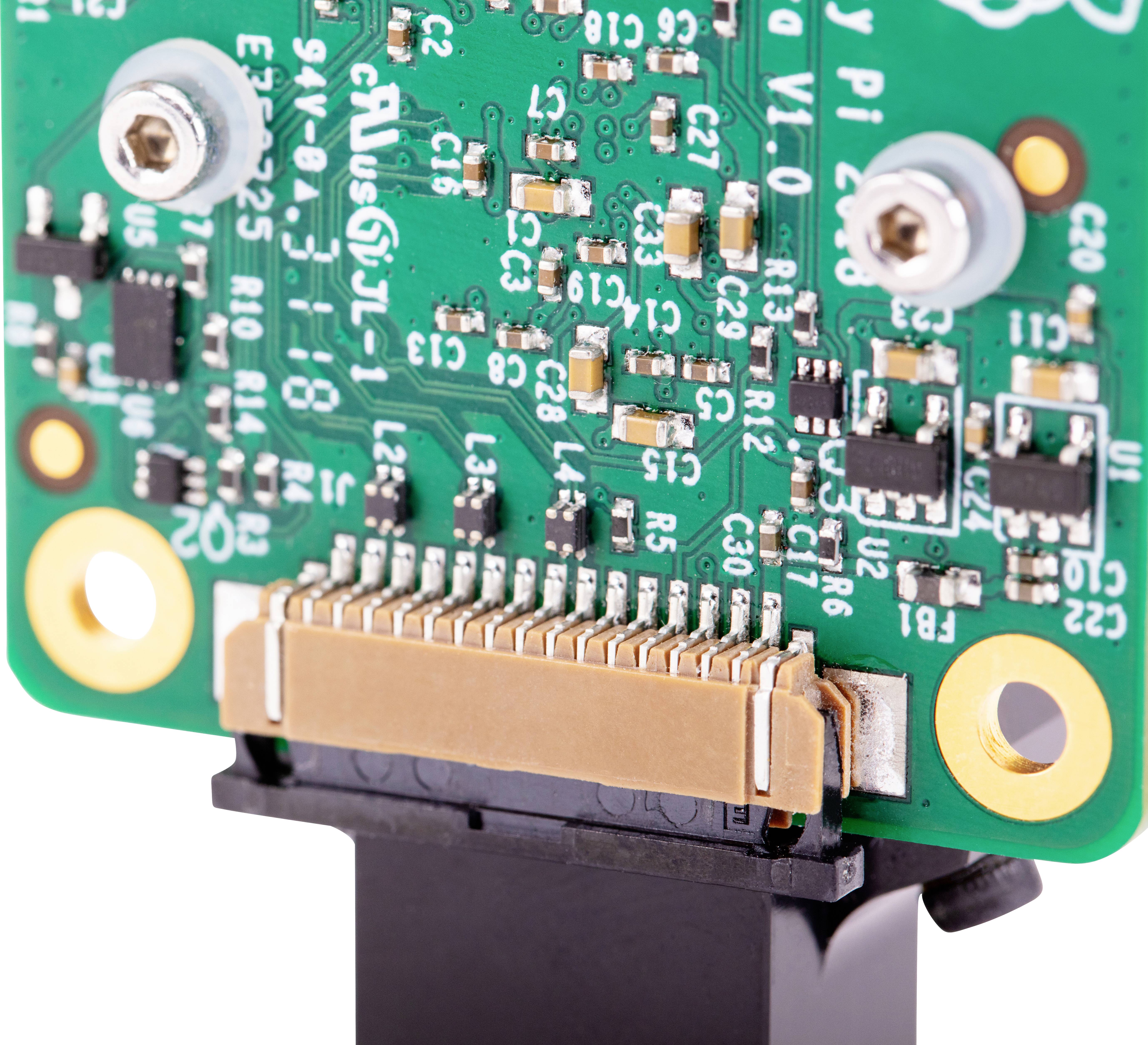 Nahaufnahme einer grünen Schaltungsplatine mit elektronischen Bauteilen und Anschlüssen, die wahrscheinlich zu einem elektronischen Gerät gehört.
