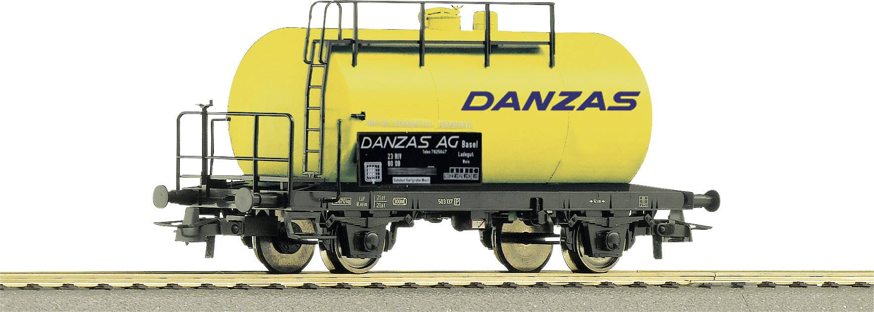 Gelber Kesselwagen mit der Aufschrift 'DANZAS'. Der Wagen hat schwarze Details und ist auf einem Gleis platziert.