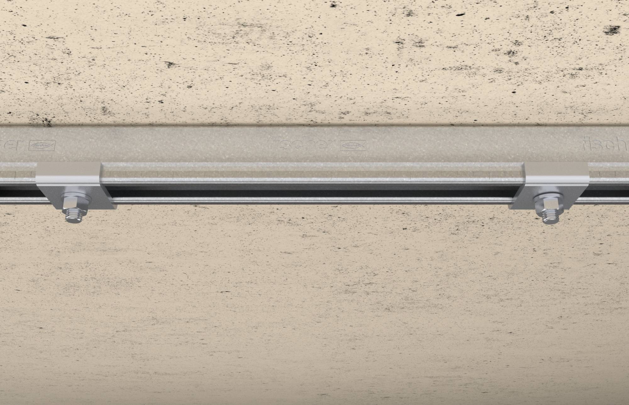 Rohrsystem an einer grauen Betonwand befestigt mit Metallhalterungen und großen Schrauben.