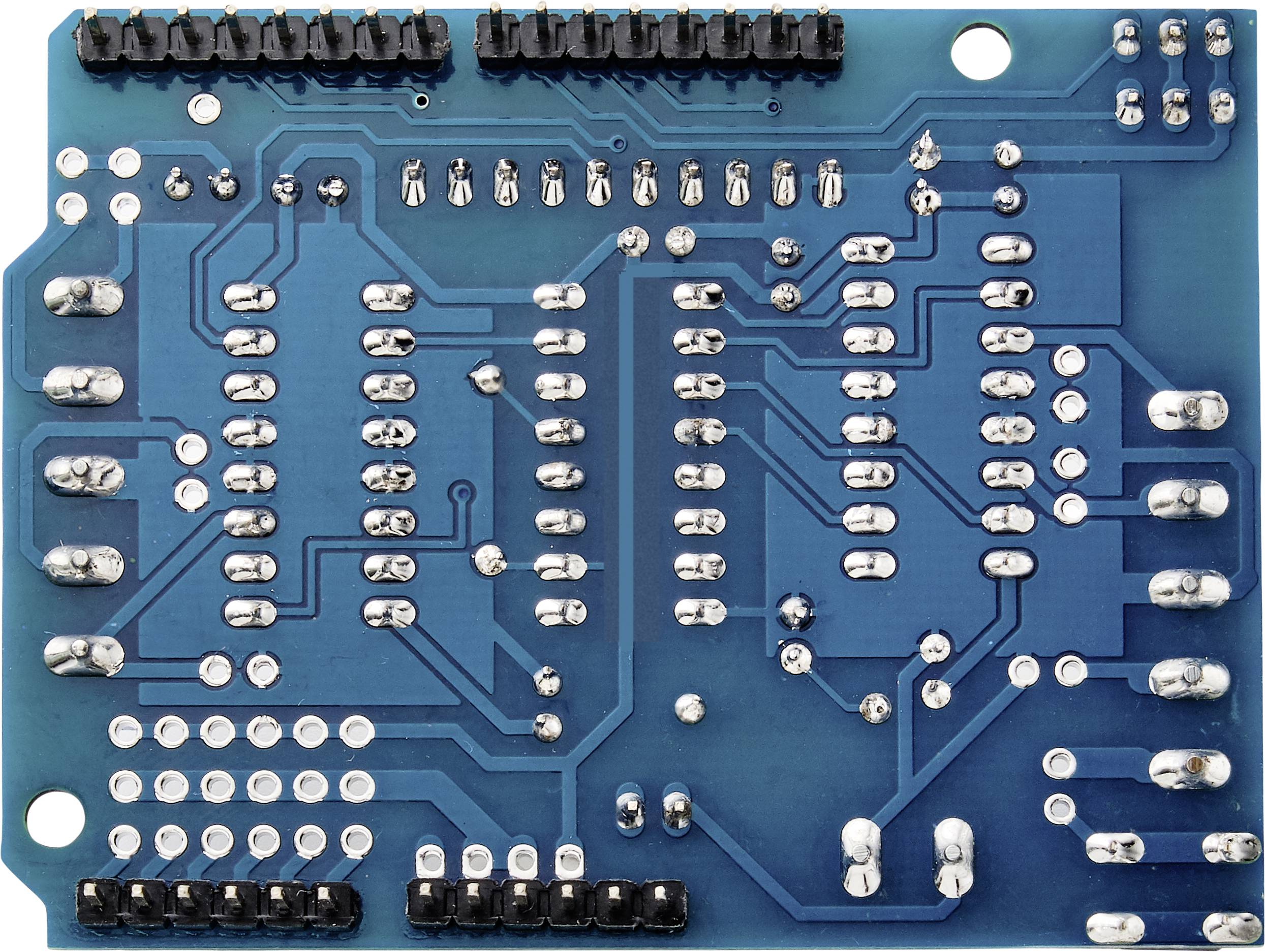 Eine blaue Leiterplatte mit zahlreichen silbernen Lötkontakten und elektrischen Verbindungen, die elektronische Schaltungen unterstützen.