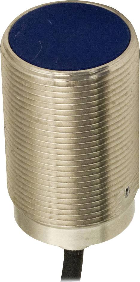 Zylindrischer Näherungssensor mit geriffeltem Metallkörper und schwarzer Vorderseite. Ein Kabel ist an der Unterseite angeschlossen.