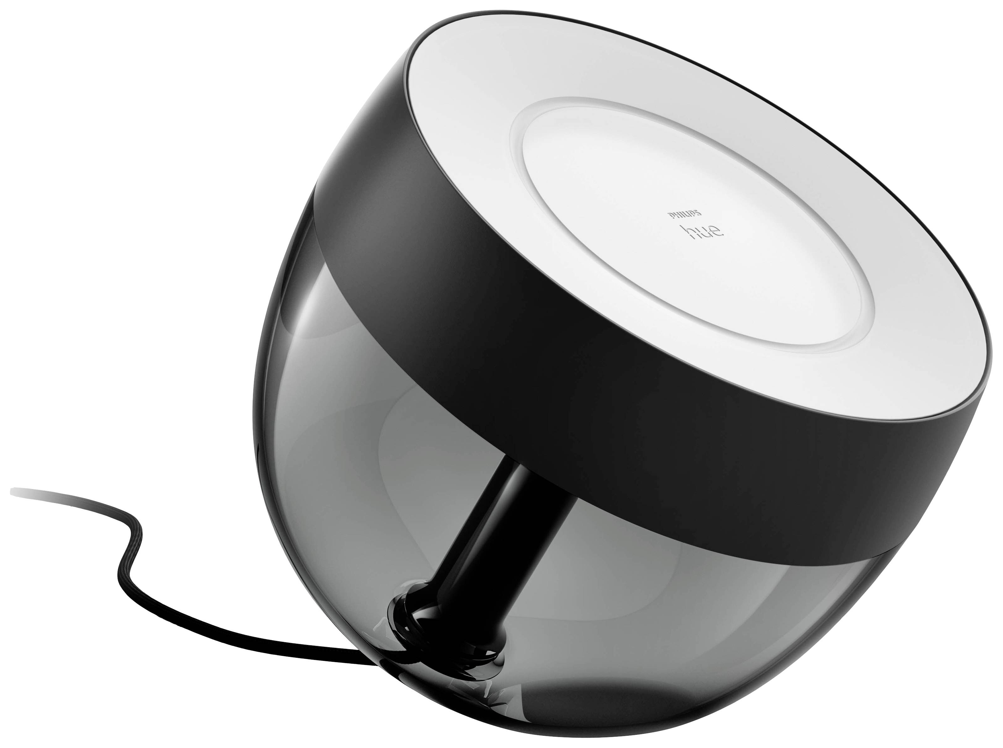 Schwarze Philips Hue Tischleuchte mit transparentem Gehäuse, angeschlossen an ein schwarzes Kabel.