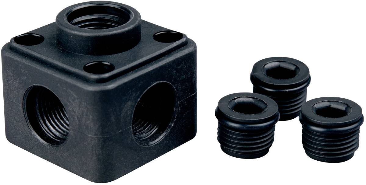 Ein schwarzer Metallblock mit mehreren Gewindebohrungen auf allen Seiten und drei separate Schraubkappen daneben.