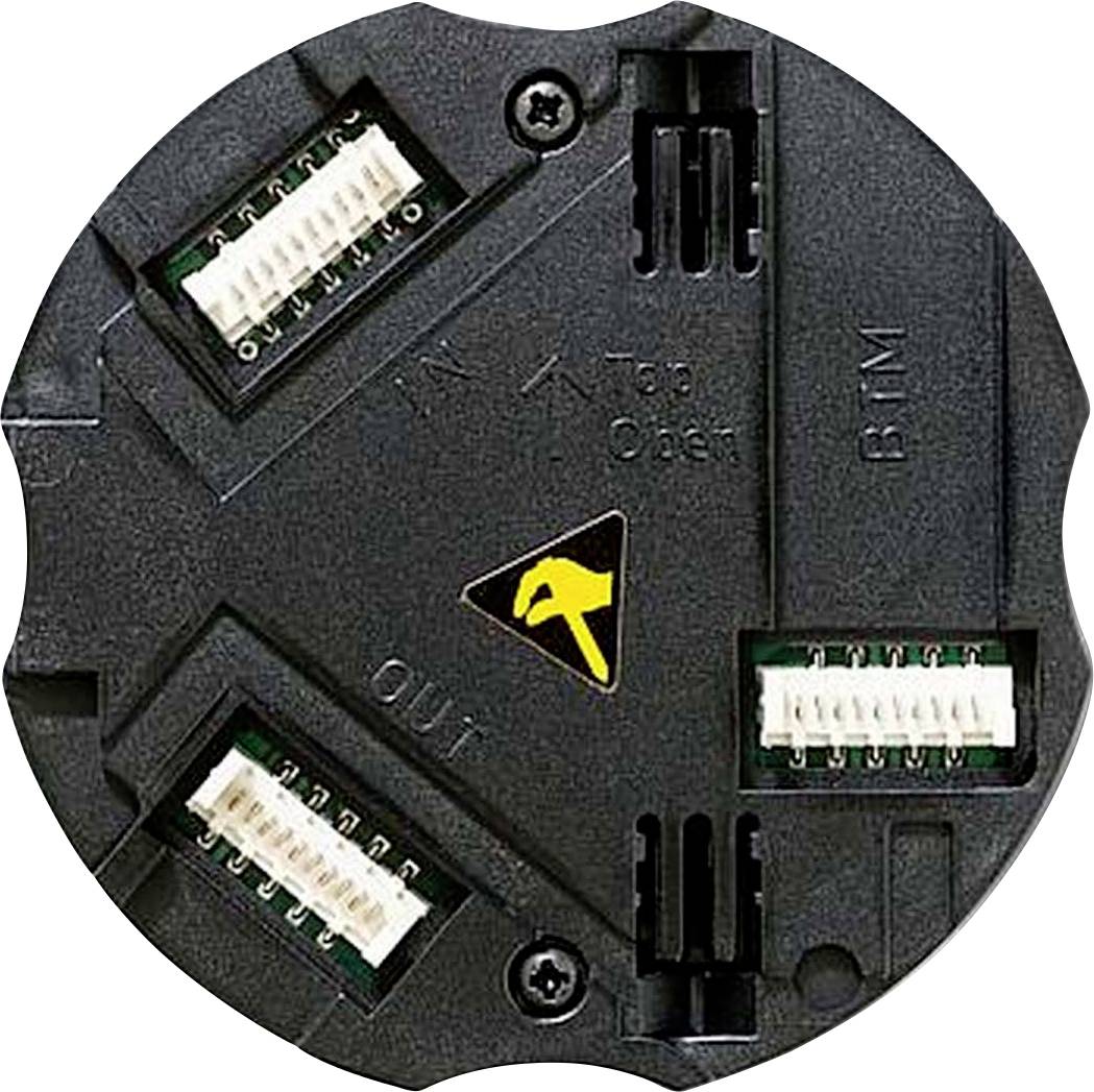 Schwarzes, rundes elektrisches Bauteil mit mehreren Anschlusssteckern und einem Warnsymbol in der Mitte.