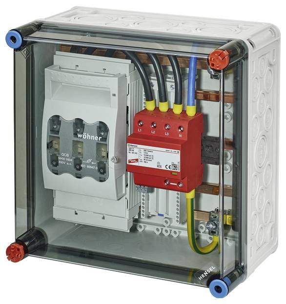 Elektrischer Schaltkasten mit transparentem Deckel, zeigt Sicherungen und Verdrahtung im Inneren; primär für Stromverteilung.
