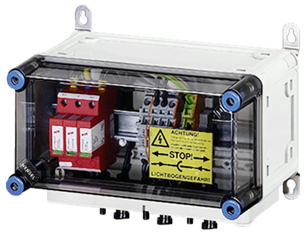 Elektrischer Verteilerkasten mit durchsichtigem Deckel, innen befinden sich elektrische Komponenten und eine gelbe Warnung 'Achtung! Stop! Lichtbogengefahr'.