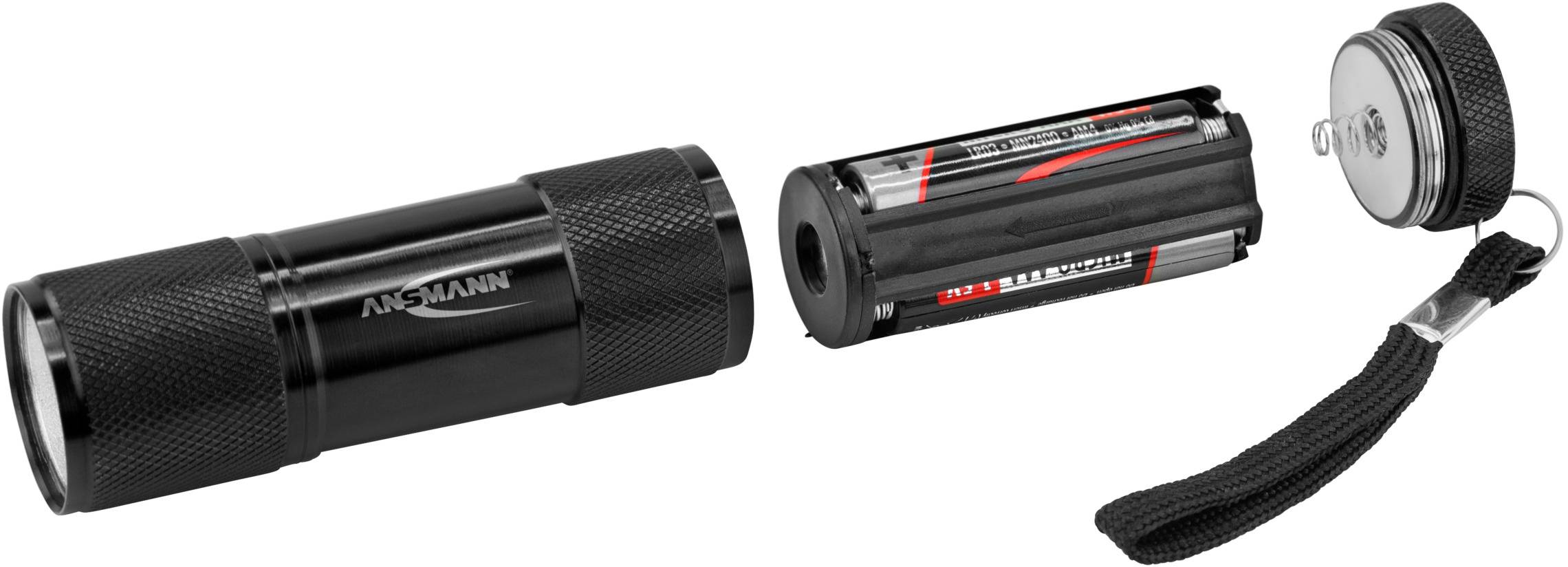 Zerlegte Taschenlampe mit Batteriefach und Deckel, ausgestattet mit Handschlaufe.