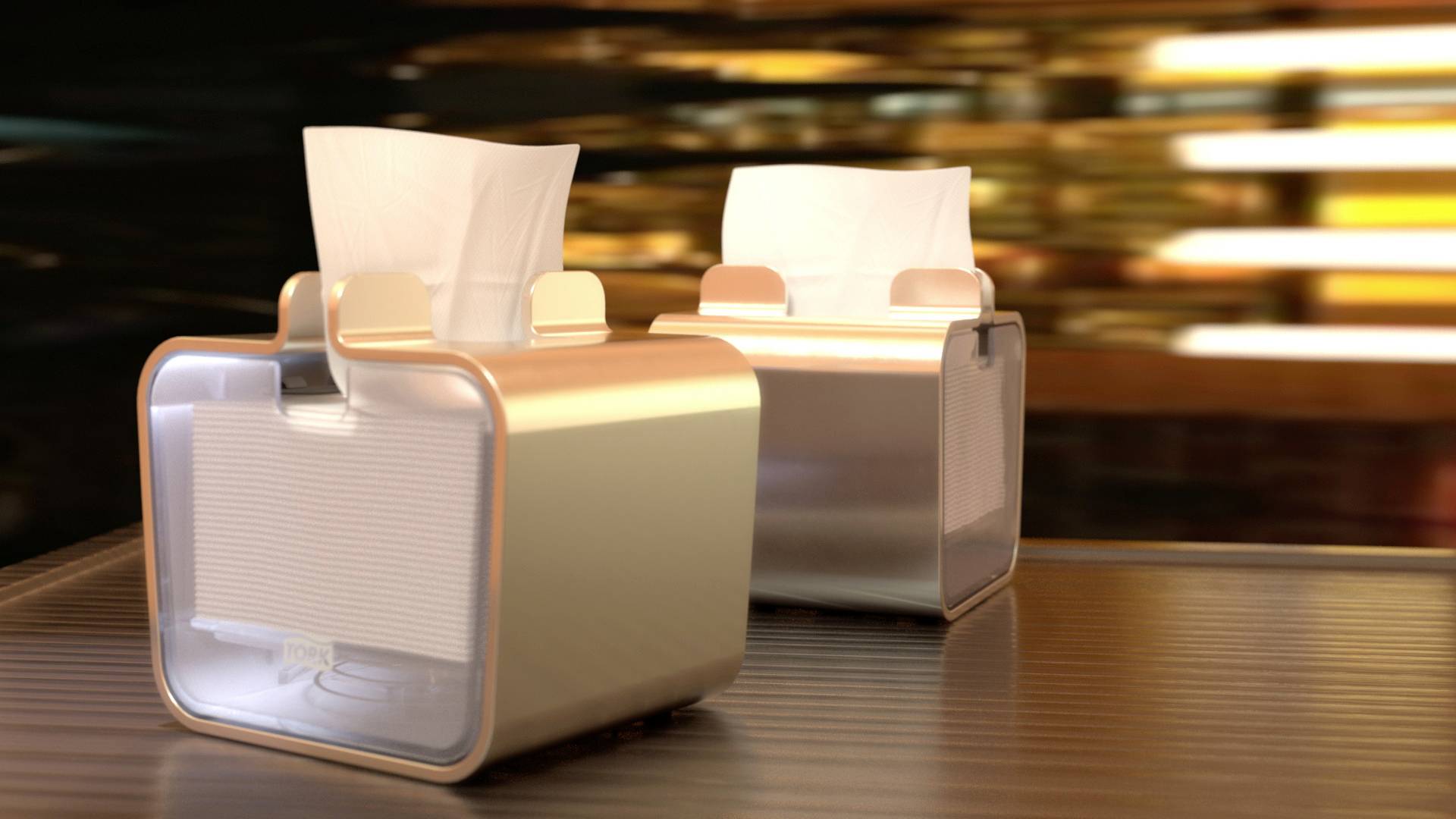 Zwei stilvolle Taschentuchspender in goldener Umgebung auf einem Tisch. Die Spender haben ein modernes Design und enthalten weiße Taschentücher.