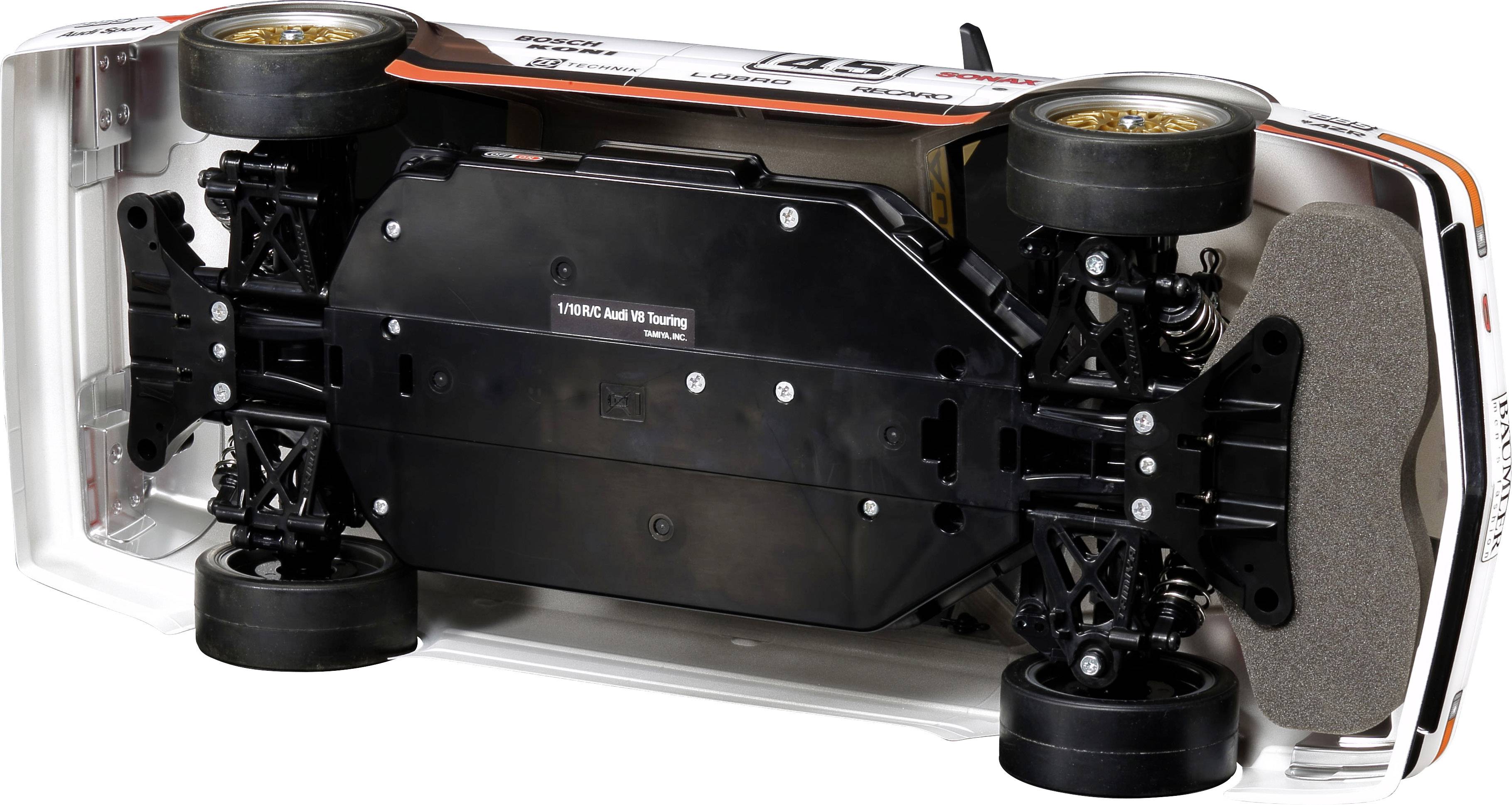 Spielzeugauto auf der Seite liegend, zeigt den detaillierten Unterboden und Fahrwerksteile.