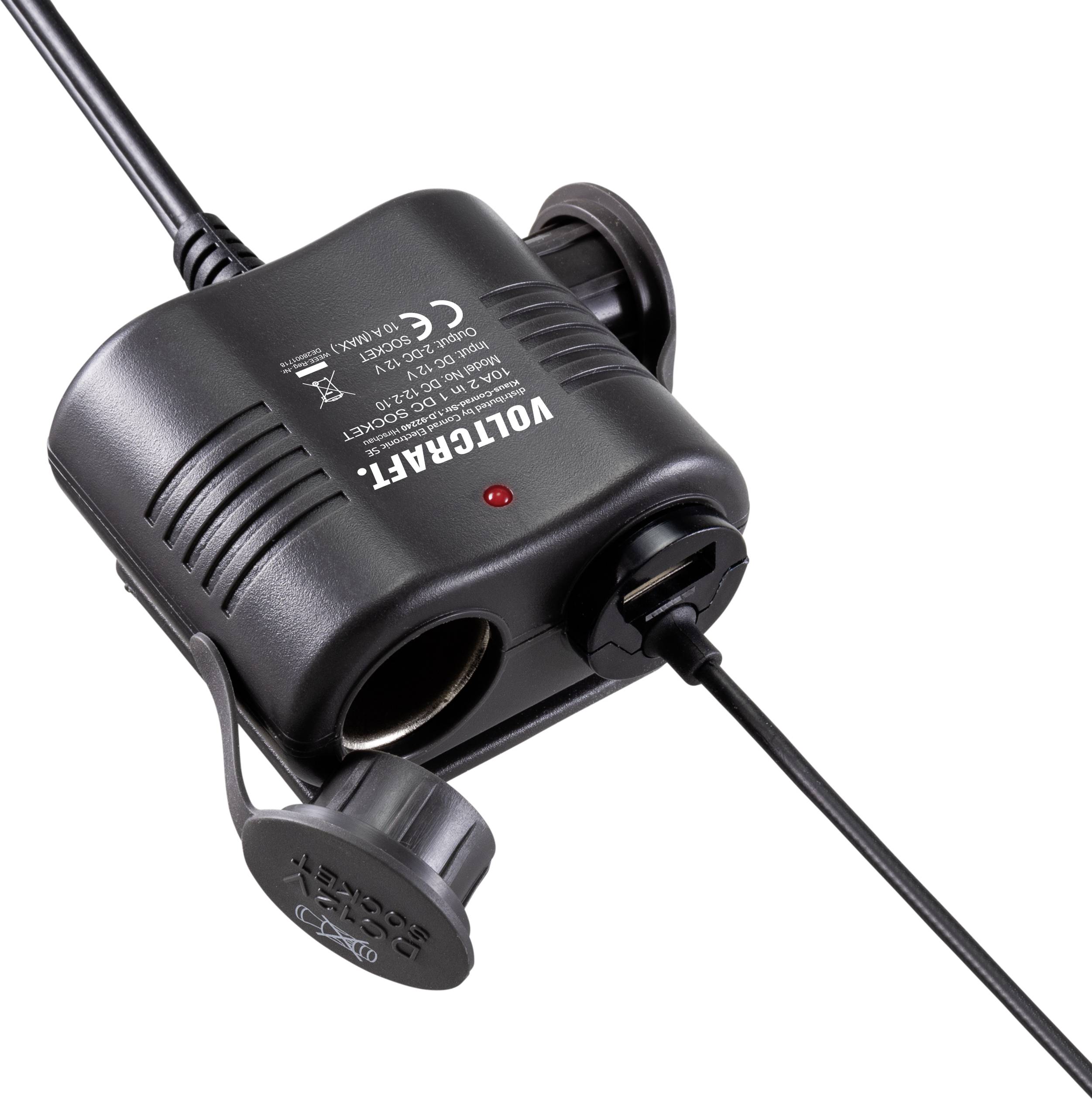 'Voltcraft' Zigarettenanzünder-Adapter mit USB-Anschluss und Kabel. Schwarzes Gehäuse mit aufgedruckten technischen Spezifikationen.