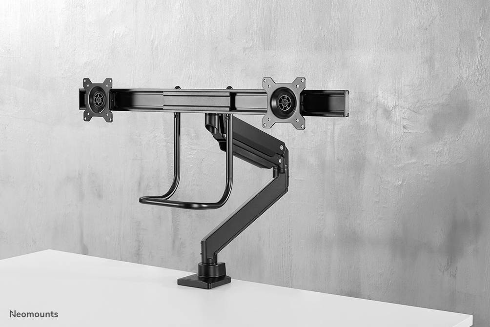 Ein doppelter Monitorarm aus schwarzem Metall, befestigt an einem Schreibtisch, vor einem grauen Hintergrund. Ideal für zwei Monitore.