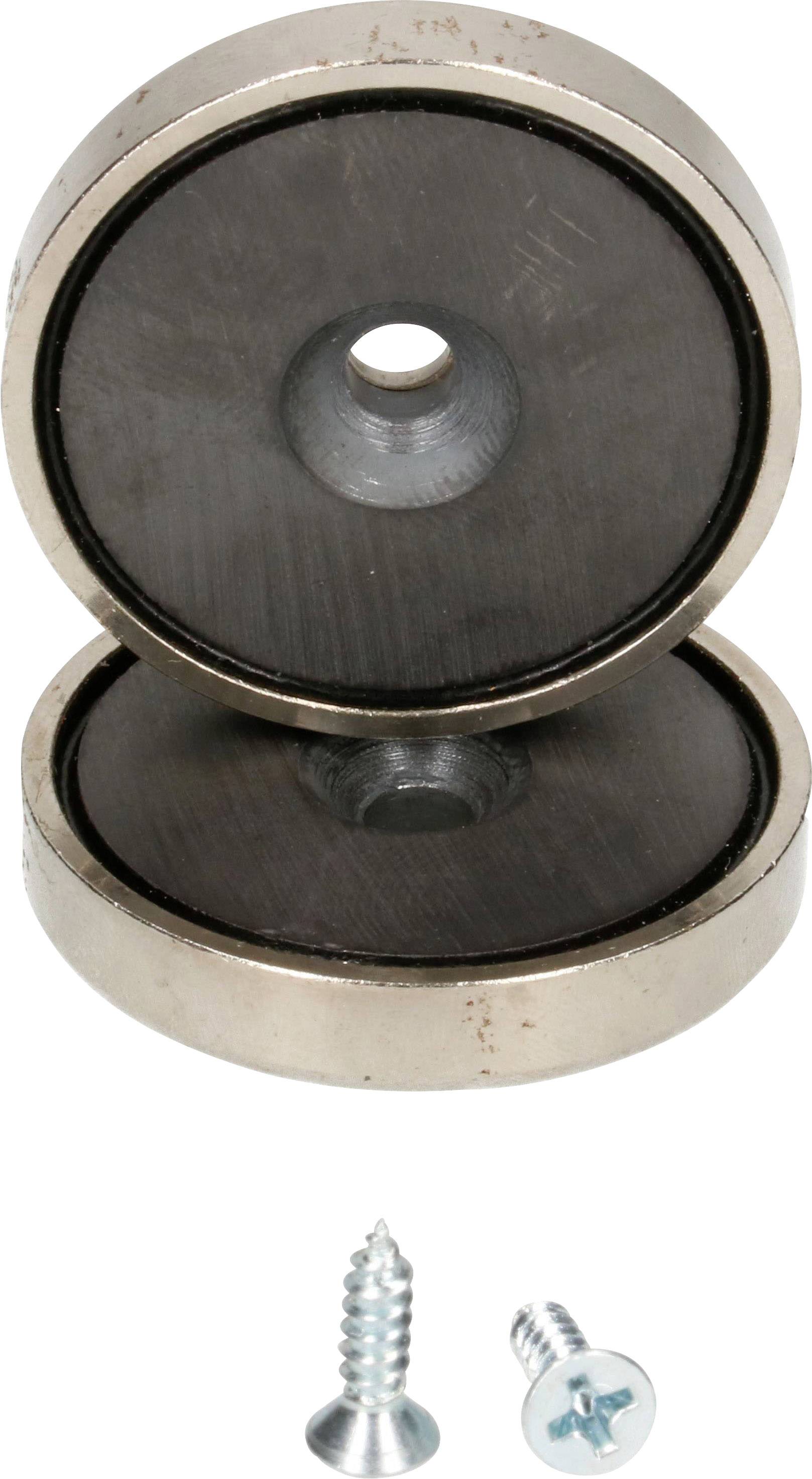 Zwei runde Magnete mit zentralem Loch, übereinander gestapelt. Zwei Schrauben liegen darunter.