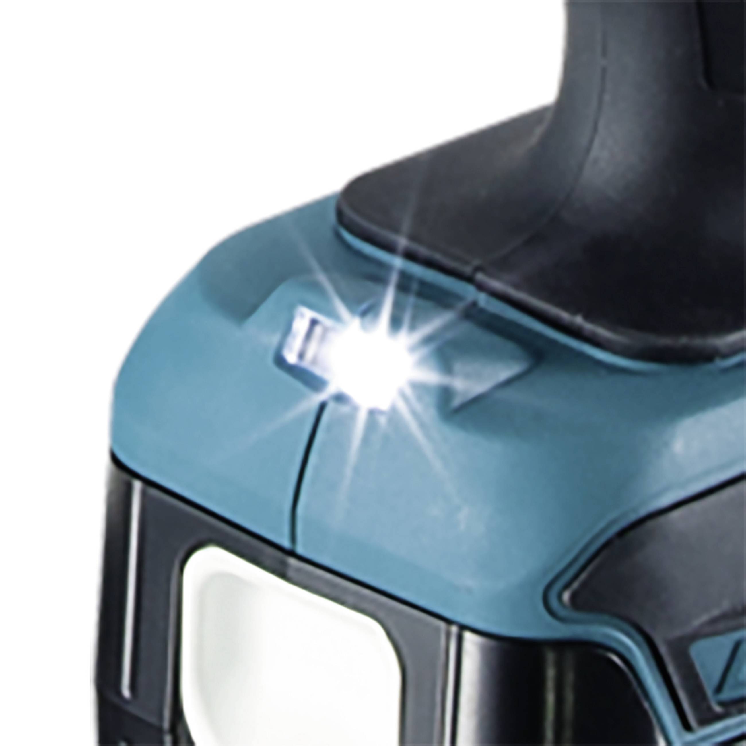 Ein leuchtendes LED-Licht an einem blauen Elektrowerkzeug, das die Arbeitsfläche erhellt.