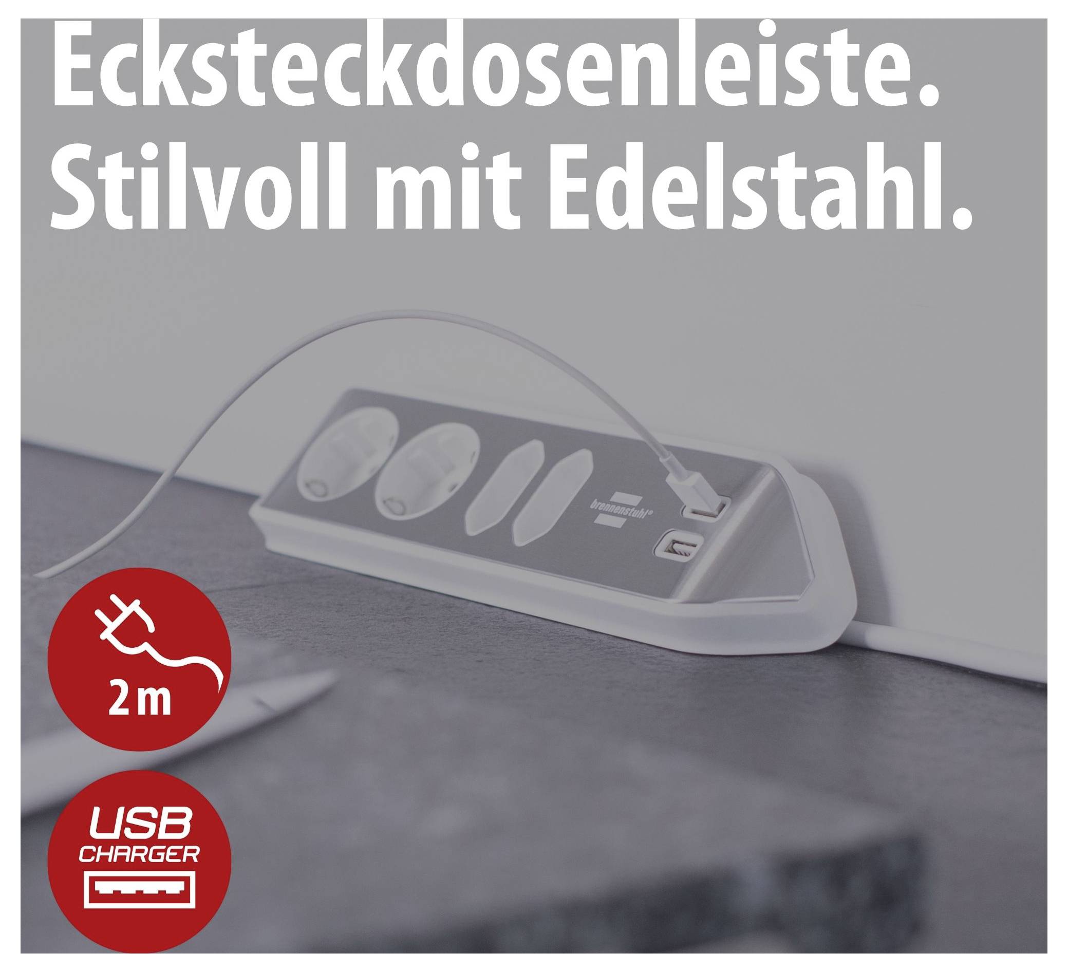 Werbebild einer Edelstahl-Ecksteckdosenleiste mit angeschlossenem USB-Kabel; Text: 'Ecksteckdosenleiste. Stilvoll mit Edelstahl.' und Symbole für 2 m Kabellänge und USB-Charger.