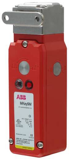 Rotes ABB Sicherheitsrelais mit Metallabdeckung und Modellnummer 'MKey9M', Hauptschalter und Statusanzeige, aufrecht dargestellt.