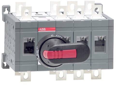 Ein elektrischer Hauptschalter in einer grauen Box mit rotem Schalter zeigt die Position 'ON'. Mehrere Anschlusspunkte sind sichtbar.