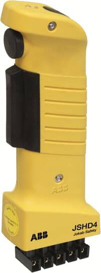 Ein gelbes industrielles Handsteuergerät mit schwarzem Griff und mehreren Anschlüssen, für Sicherheitskontrollen im Maschinenbau.