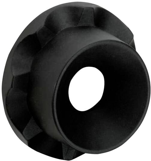 Schwarzes Kunststoffteil mit runder, hohler Mitte und geriffeltem Rand, möglicherweise ein Adapter oder Aufsatz für ein technisches Gerät.