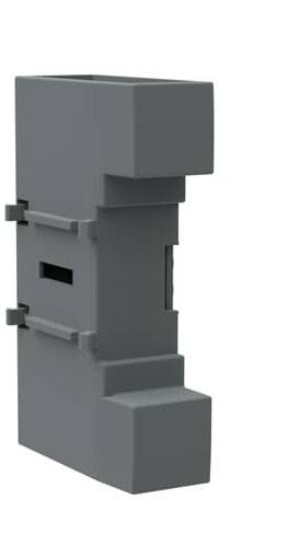 Ein graues, rechteckiges Plastikgehäuse mit mehreren Vertiefungen und Kanten. Es scheint ein technisches Bauteil zu sein.