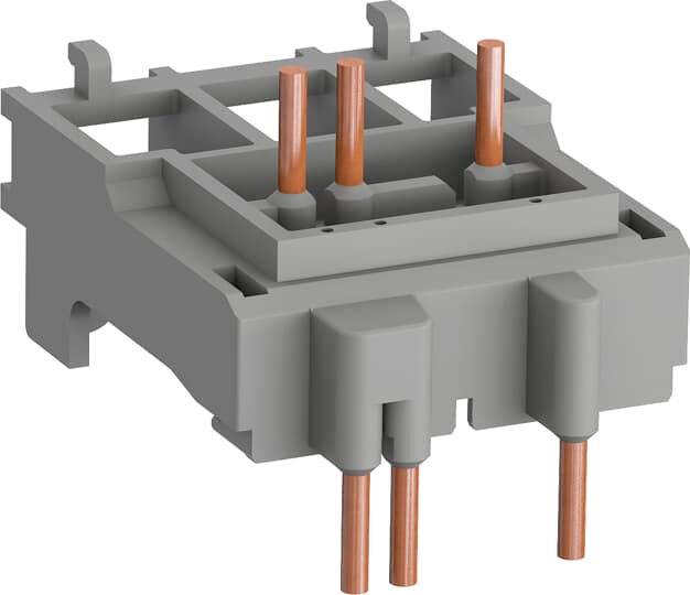 Elektrisches Steckverbindermodul mit grauem Gehäuse und mehreren herausragenden Kupferstiften zur Verbindung von elektrischen Leitungen.