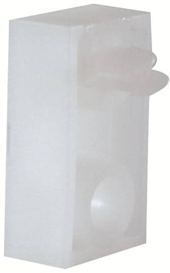 Ein rechteckiger, transparenter Kunststoffblock mit abgerundeten Ecken und einer halbkugeligen Vertiefung auf der Vorderseite.