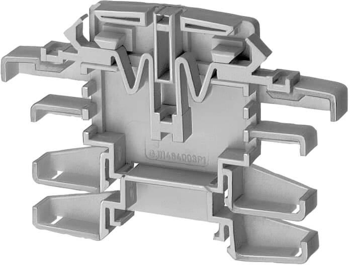 Eine graue, mehrpolige Klemmschiene aus Kunststoff zur Verbindung elektrischer Kabel, zeigt eine komplexe, mehrstufige Struktur.