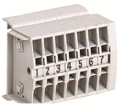 Ein grau-beiges Steckanschlussmodul mit sieben nummerierten Kabelverbindungen von 1 bis 7, verwendet für elektrische Schaltungen.