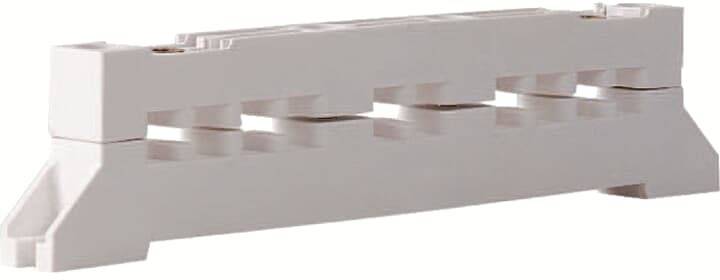 Kunststoffblock in rechteckiger Form mit fünf Aussparungen in der Mitte.