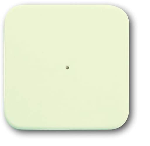 Ein einfaches, quadratisches, blassgelbes Objekt mit einer kleinen zentralen Bohrung.