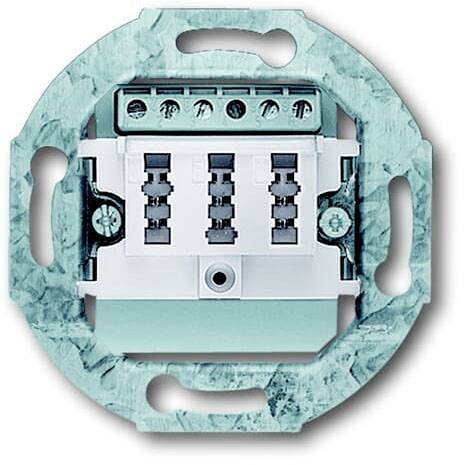 Ein elektrischer Schalterunterbau, rechteckig, ohne Abdeckung, mit Kabelanschlüssen oben und Grüner Metallrahmen zur Befestigung.