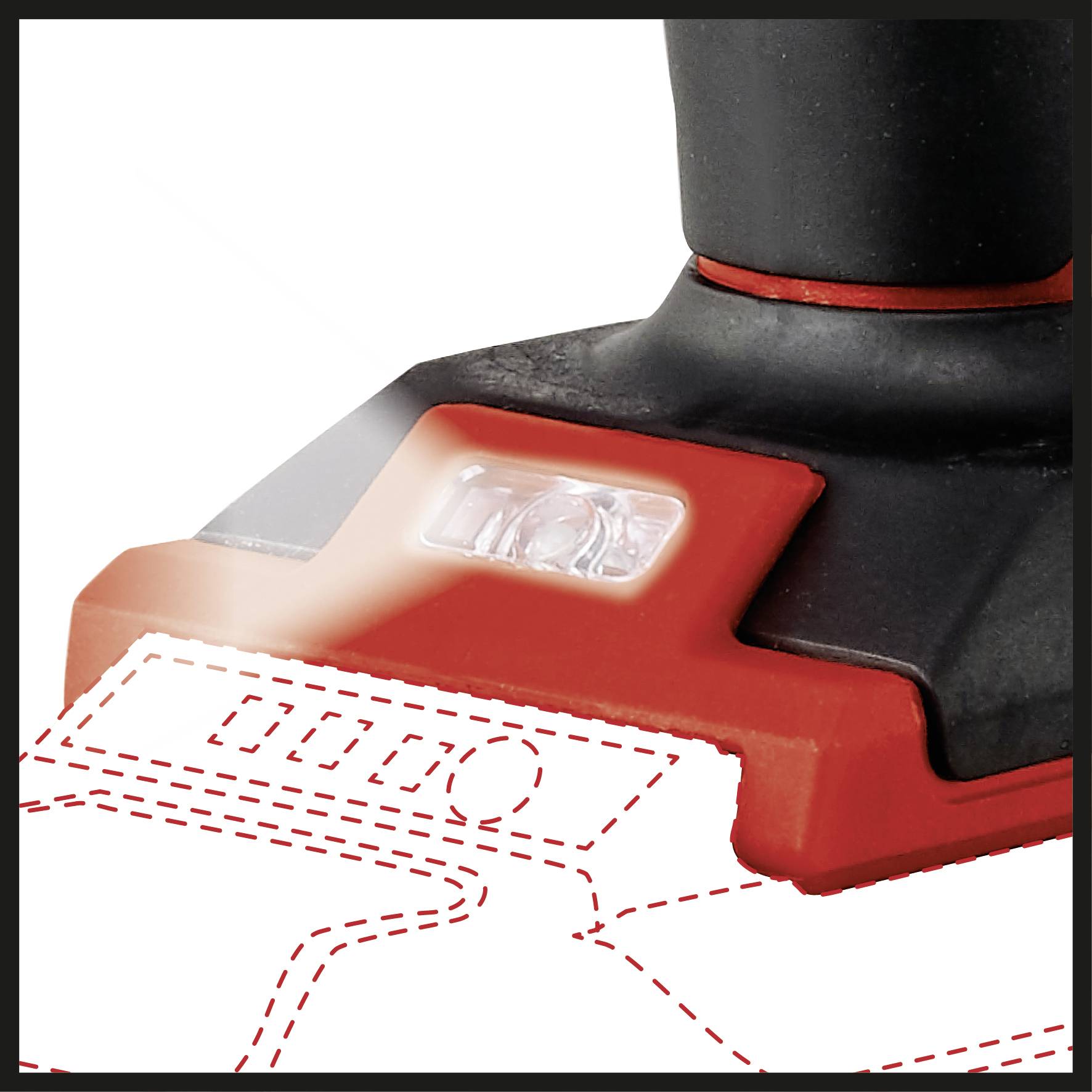 Ein Detail eines roten Elektrowerkzeugs mit einem LED-Licht, das die Arbeitsfläche beleuchtet.