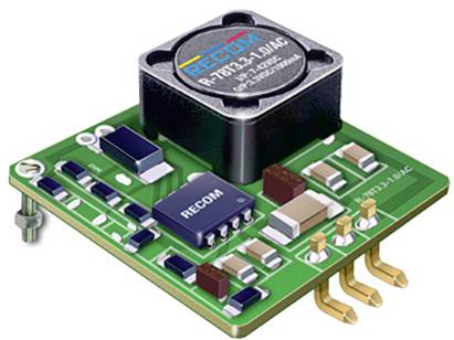 Eine grüne elektronische Schaltung mit mehreren Komponenten, darunter ein großer quadratischer Chip und der Text 'RECOM' auf zwei Bauteilen.
