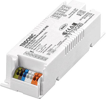 Ein rechteckiger, weißer LED-Treiber von Tridonic mit mehreren Anschlussklemmen und technischen Beschriftungen auf der Oberfläche.