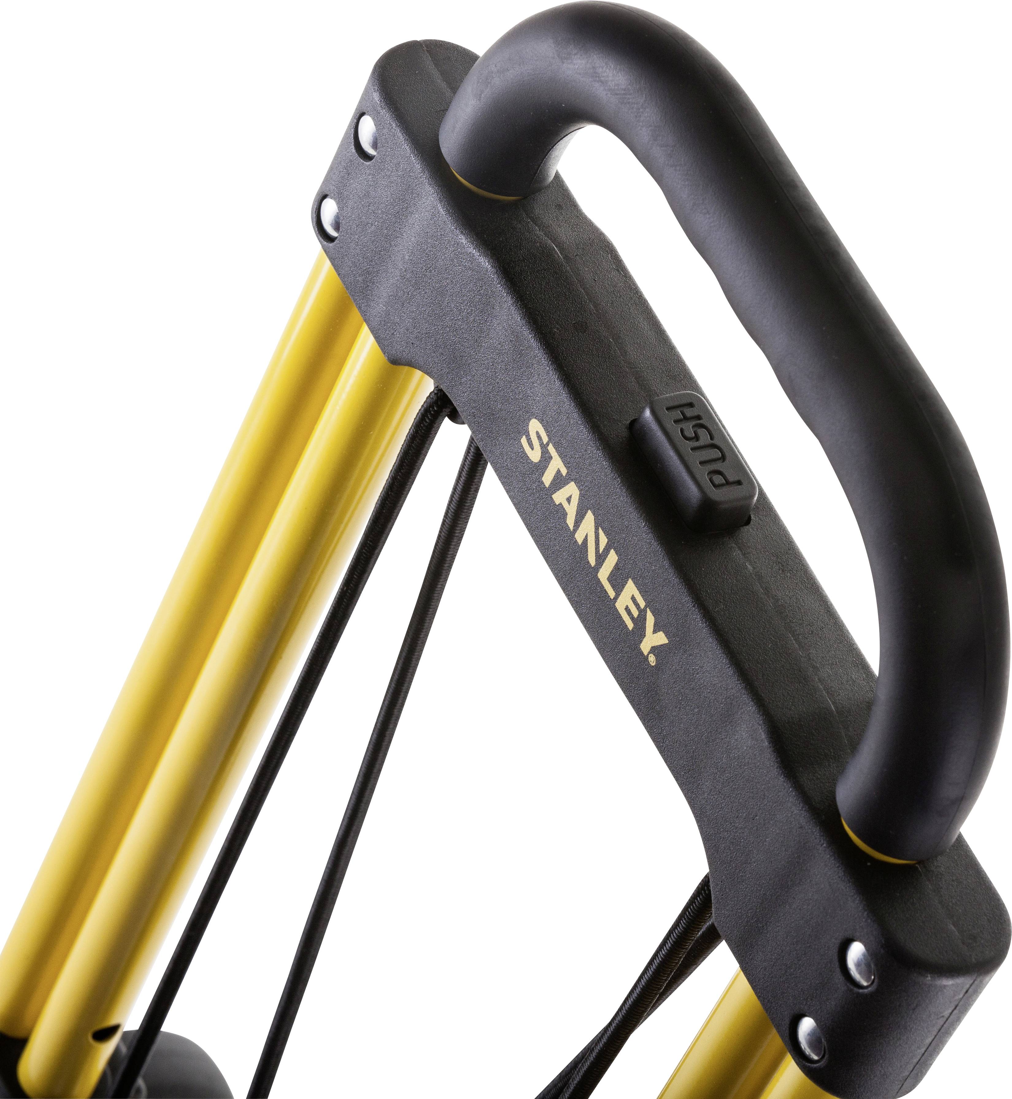 Transportwagen mit gelbem Metallrahmen und schwarzem Griff, auf dem 'PUSH' steht, von der Marke Stanley.