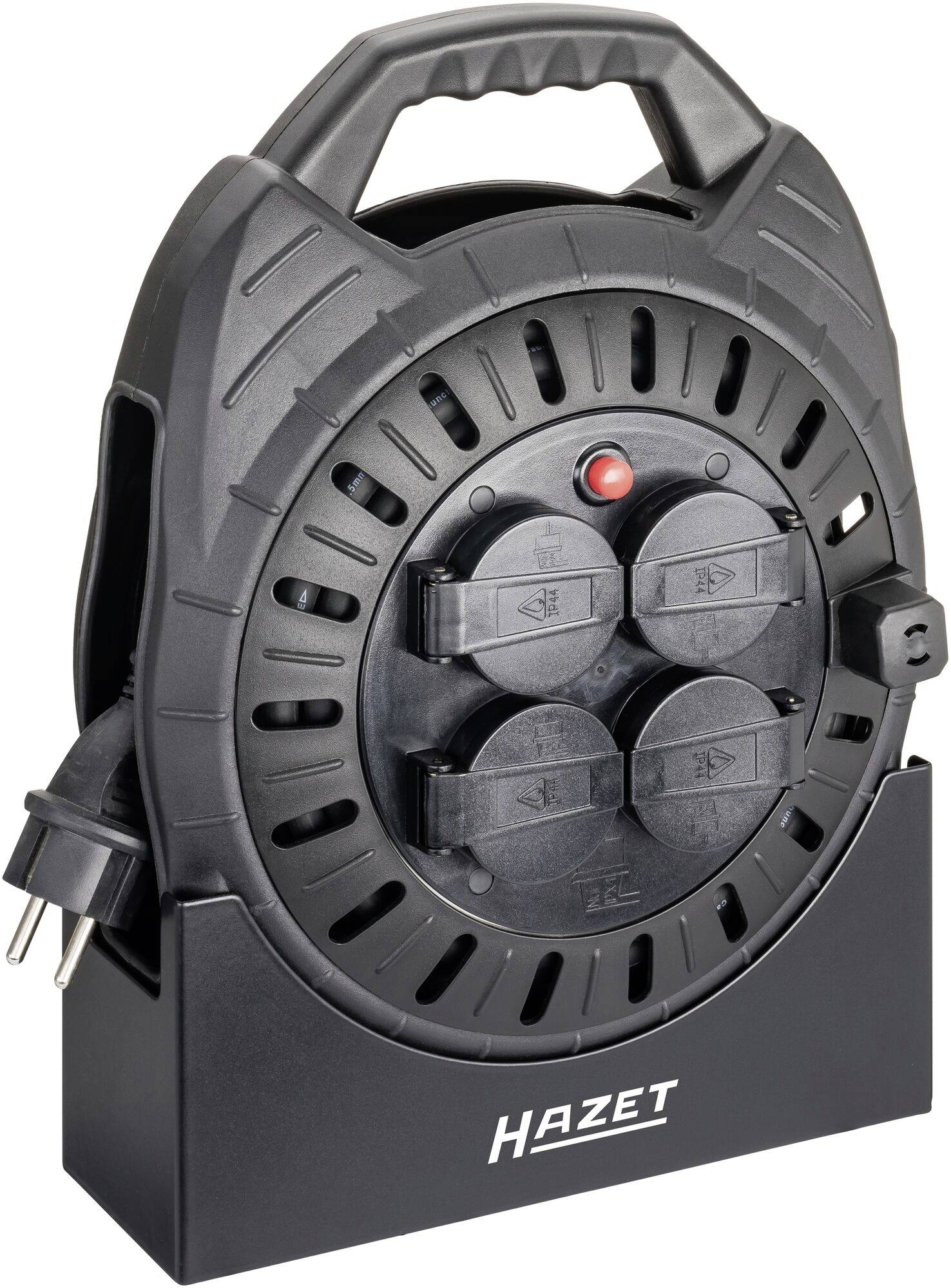 Kabeltrommel mit vier Steckdosen und einem Griff, platzsparend aufgerollt, ideal für mobile Stromversorgung bei handwerklichen Arbeiten.