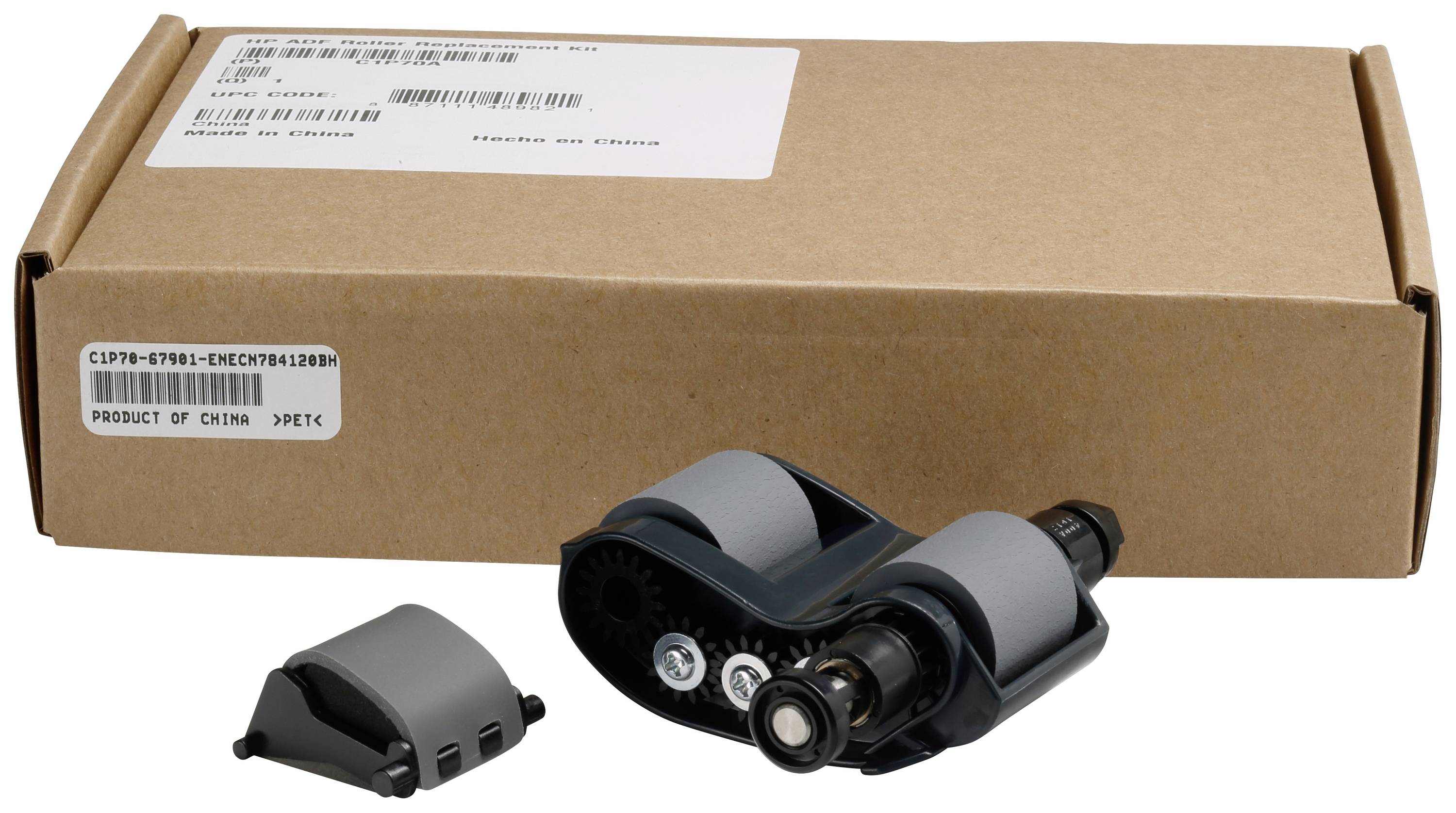 Ein Komponentenset in Grau-Schwarz auf weißem Hintergrund, bestehend aus einem mechanischen Teil und einer kleineren, abnehmbaren Abdeckung, mit Verpackung im Hintergrund.